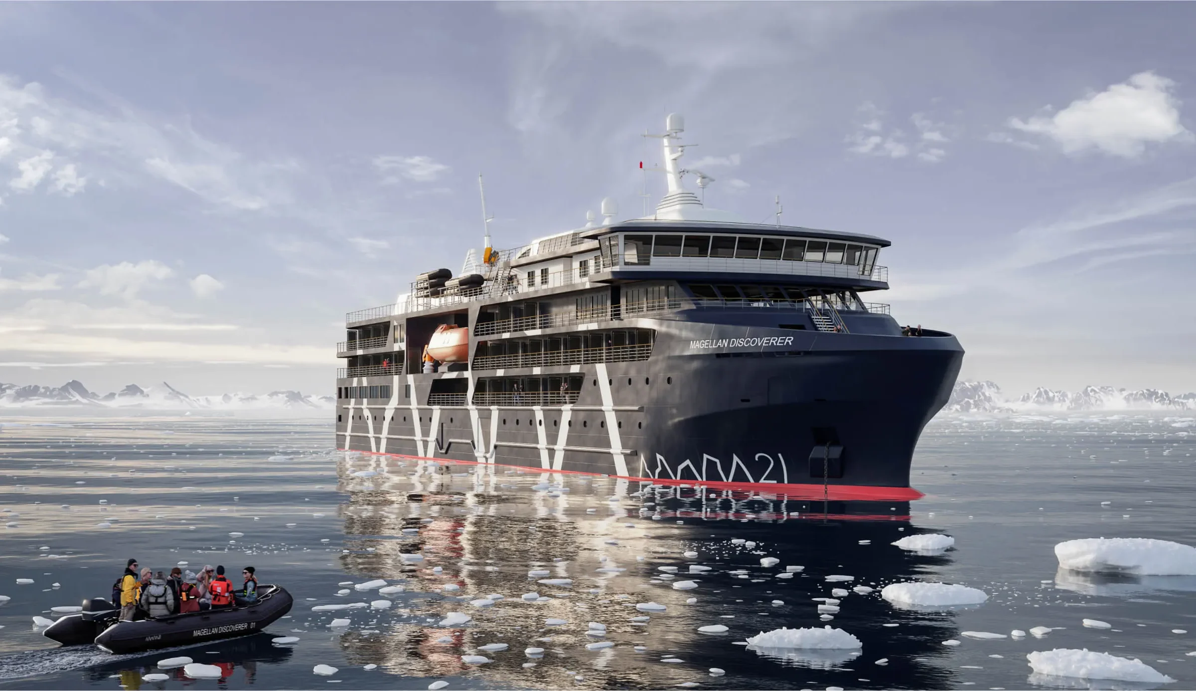 Antarctica21's Magellan Discoverer in icy water with a Zodiac alongside and snow-covered mountains behind