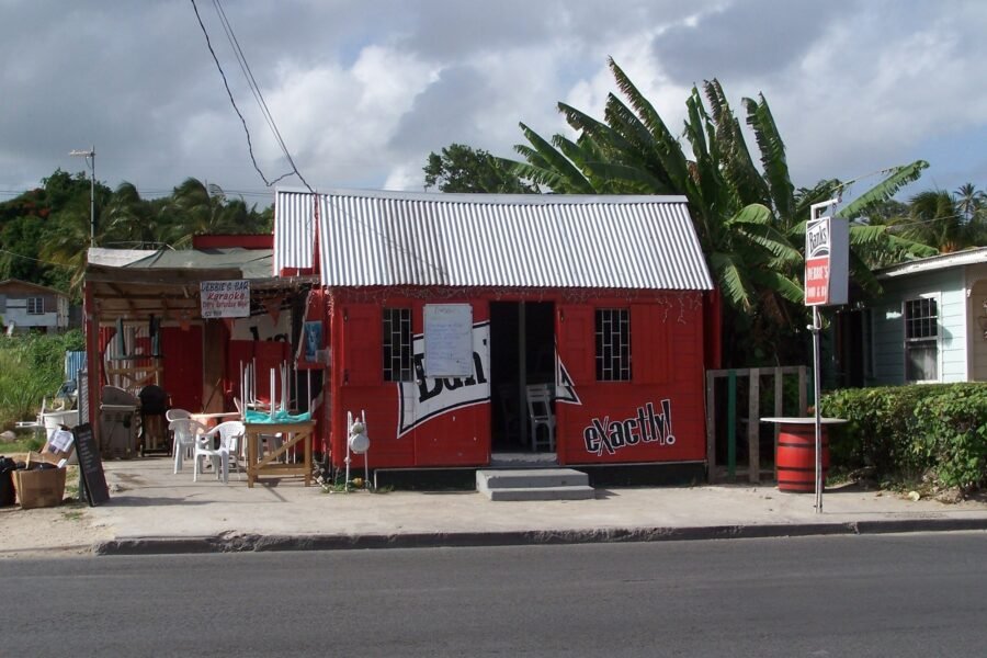 A red-painted rum shop beside the road in Barbados