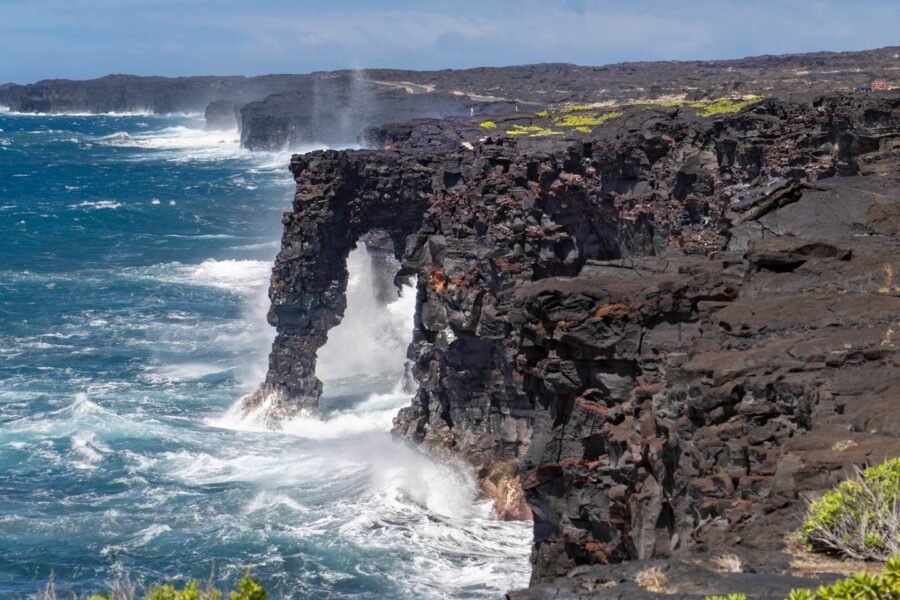The Hōlei Sea Arch standing above the Pacific in Hawaiʻi Volcanoes National Park in 2022, before its collapse.