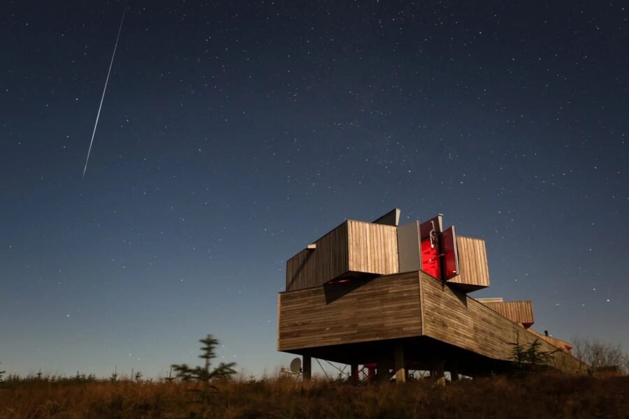 A meteor streaks across the night sky above Kielder Observatory in Northumberland, December 2019.