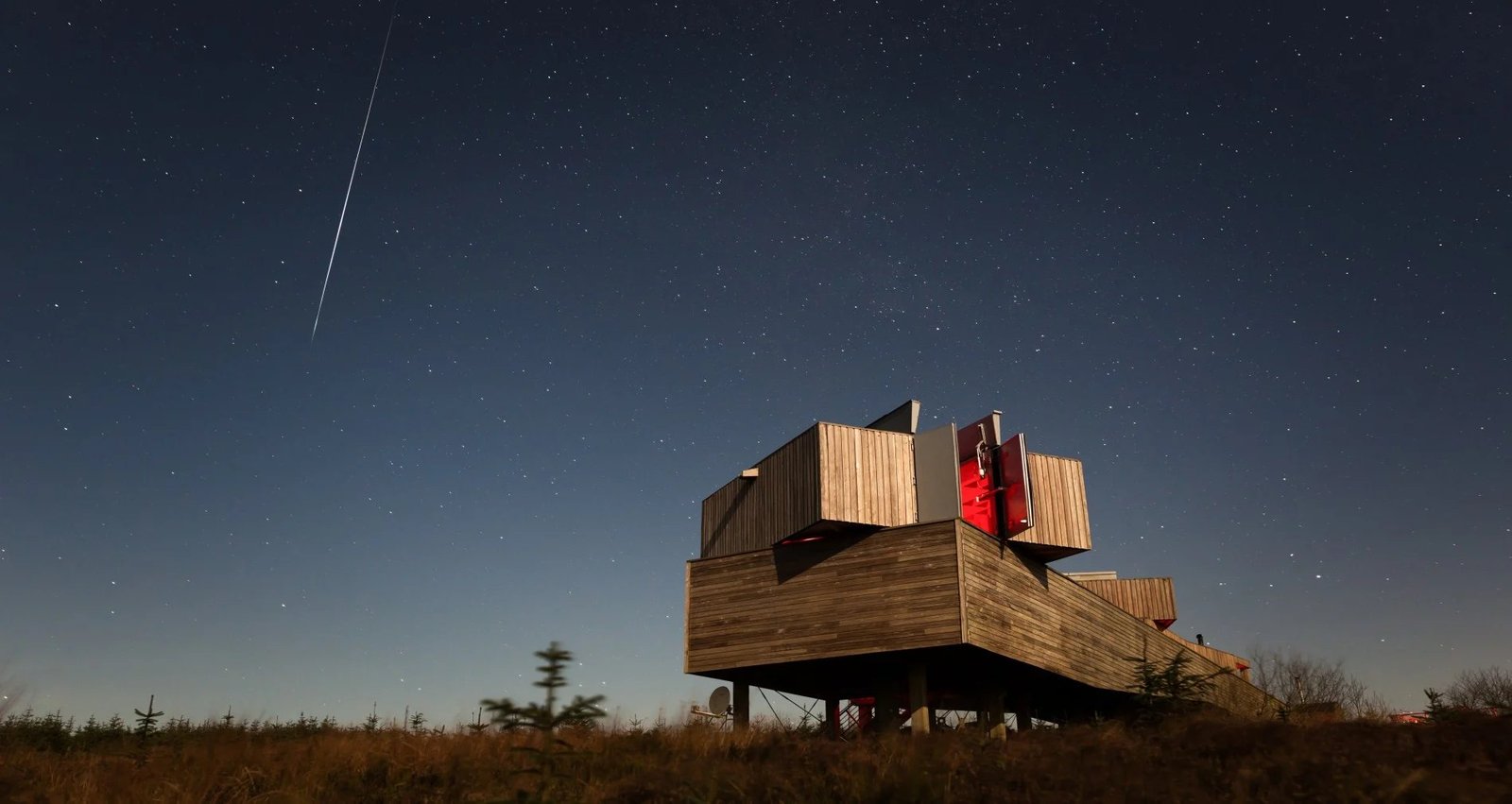 A meteor streaks across the night sky above Kielder Observatory in Northumberland, December 2019.