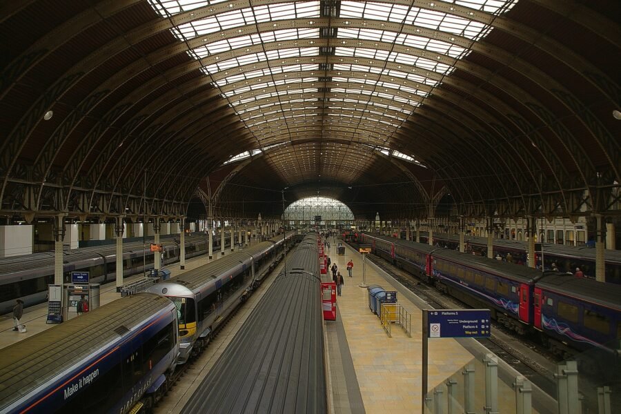 Trains under the roof of London Paddington station.