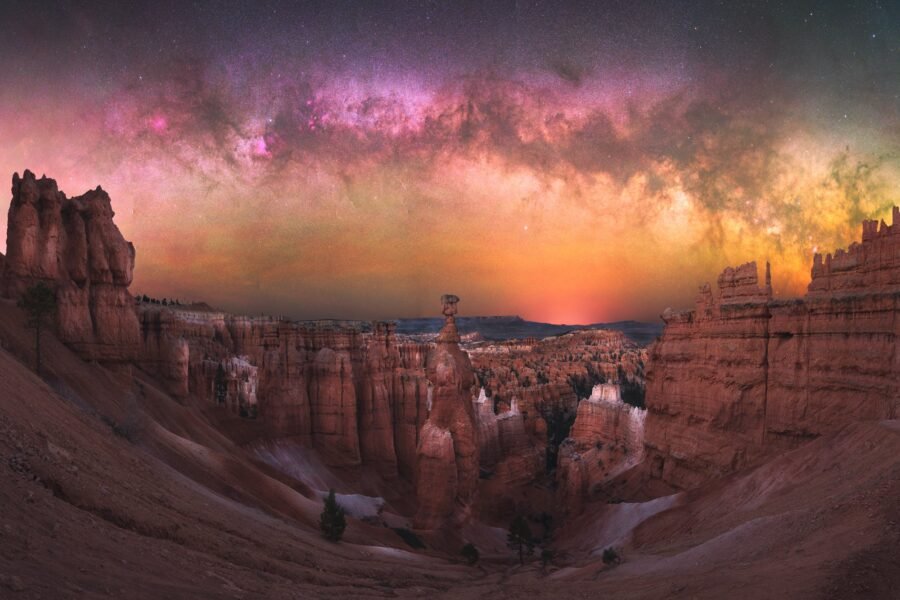 Thor's Hammer hoodoo in Bryce Canyon National Park under a dark, star-filled night sky.